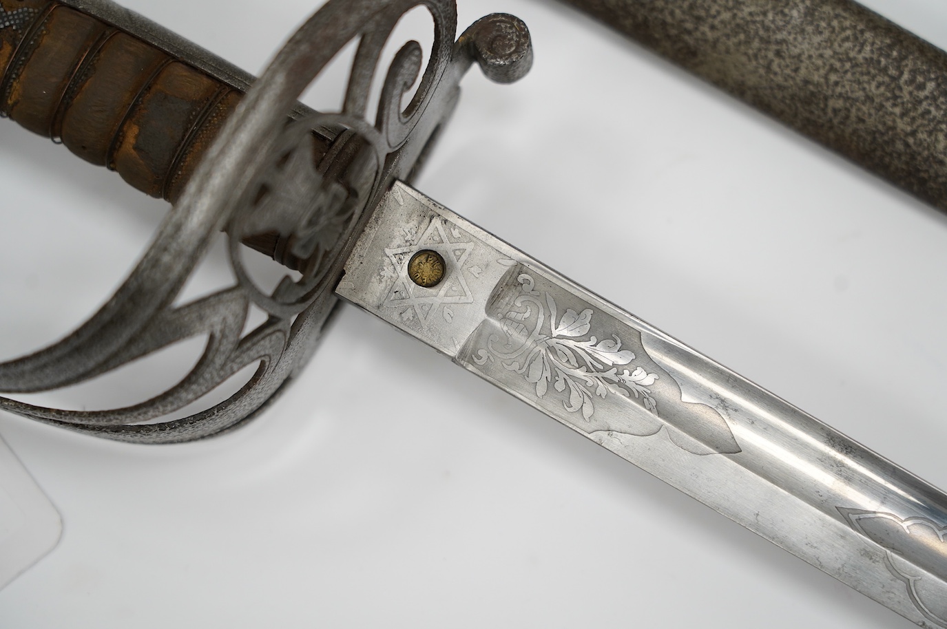 An 1827 pattern Victorian Rifle Officer’s sword, the blade etched with crowned VR and bugle, regulation hilt and scabbard, blade 82.5cm. Condition - poor